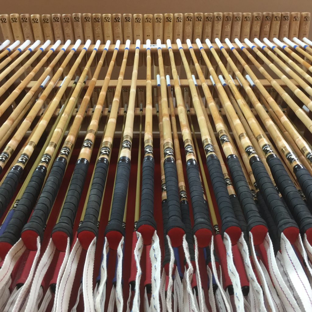 Rack of polo mallets ready for sale